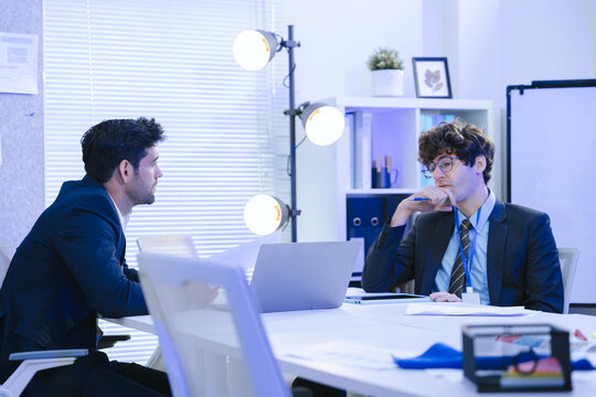 Business teamwork meeting in a modern office where diverse professionals review reports and discuss strategy, collaboration, leadership, planning, productivity, corporate analysis and growth.