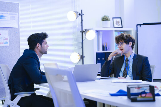 Business teamwork meeting in a modern office where diverse professionals review reports and discuss strategy, collaboration, leadership, planning, productivity, corporate analysis and growth.
