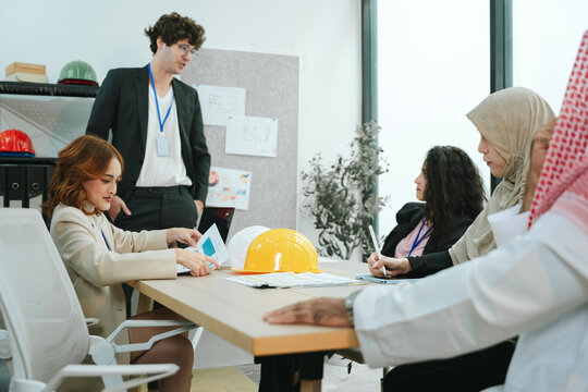 Business teamwork meeting in a modern office where diverse professionals review reports and discuss strategy, collaboration, leadership, planning, productivity, corporate analysis and growth.