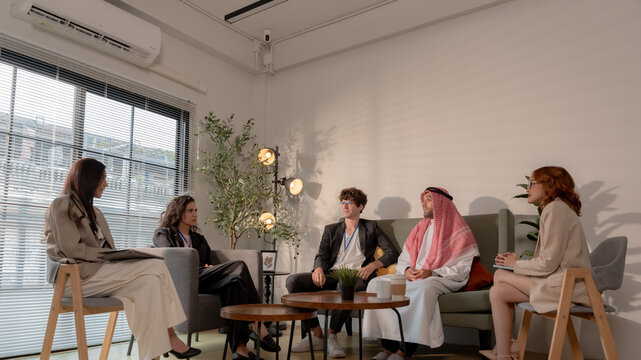 Business teamwork meeting in a modern office where diverse professionals review reports and discuss strategy, collaboration, leadership, planning, productivity, corporate analysis and growth.