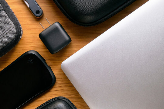 USB Charger with Gadgets on Wooden Table
