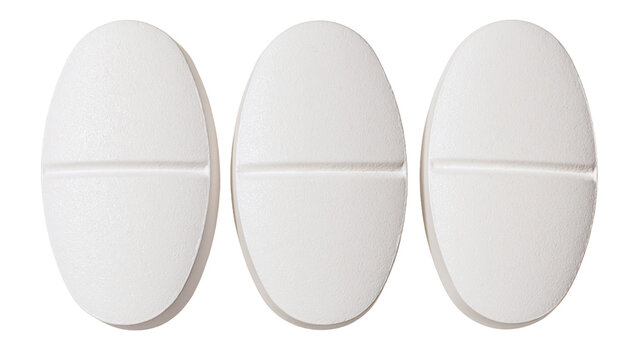 Three white oval shaped pharmaceutical pills with a center score line