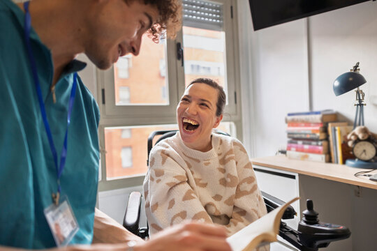 Caregiver and woman smiling, enjoying a positive interaction
