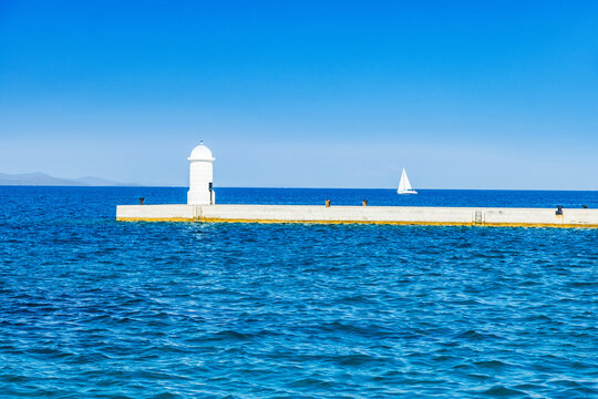 Pier and lighthouse on the Adriatic sea in Zadar, Croatia
