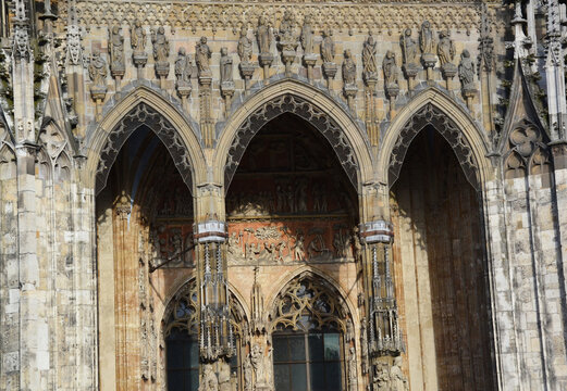 Ornate Sculpted Stone Statues above Main Entrance Portal of Ulm Minster in Ulm, Germany