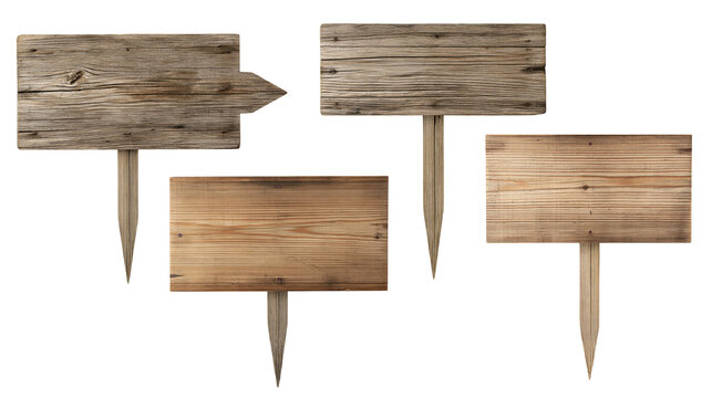 Four rustic wooden signboards with pointed stakes for garden or path direction