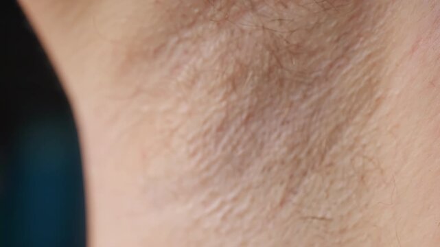Razor Removes Body Hair from Skin in an Extreme Close Up, Showing Personal Grooming and Hygiene Care