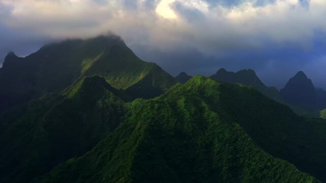 Tahiti Ito Volcano Towering mountains peaks of Teahupo'o ridges South Pacific Island French Polynesia aerial drone sunset clouds Tara Huhurahi Mount Ronui Aorai Orohena Vaiau River Valley zoom in