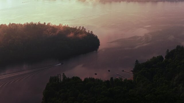 Boat ride Lake Schroon Clarks Island ummer golden hour sunset mist low clouds aerial drone harbor view Up State New York landscape Town of Schroon Lake Pharaoh Mtn Adirondack Mountains circle left