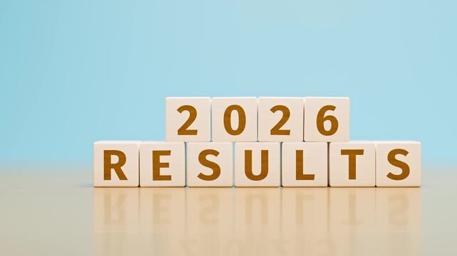 Wooden toy cubes forming the text "2026 RESULTS". Concept for financial or other results of the year 2025 of an organisation or company. Dolly camera