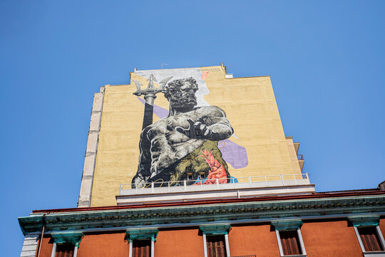 Monumental mural of Neptune by Spanish artist Kraser on a high-rise building along Lungomare Vittorio Emanuele III, Taranto, Puglia, Italy
