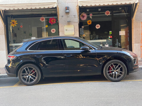 Porsche Macan GTS SUV parked on an urban street demonstrating luxury automotive design and performance engineering