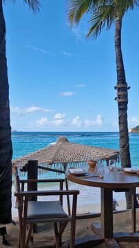 Vertical View of Beachfront Restaurant Table on St. Barthelemy Island, Saint Jean Beach and Caribbean Sea