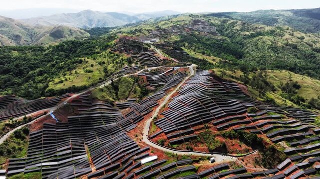 Vast solar arrays span rugged hills, reflecting strategic energy resilience