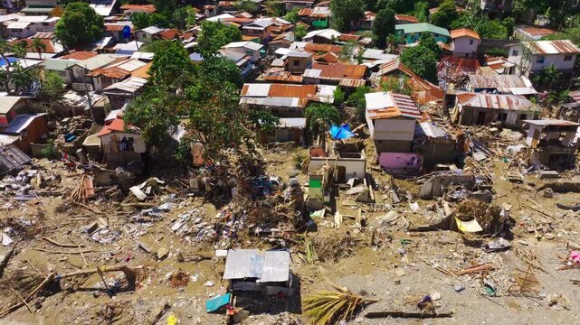 Drone slides past ruined homes and debris after typhoon in Talisay Cebu