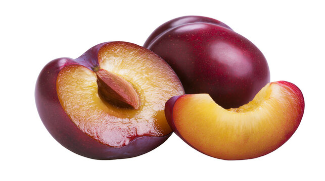 Whole and sliced ripe purple plums with visible pit and juicy yellow flesh