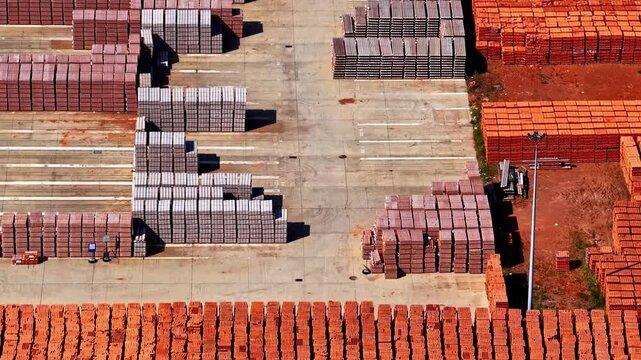 Huge piles of bricks in a construction material warehouse in aerial viiew in Pątn&oacute;w, Poland
