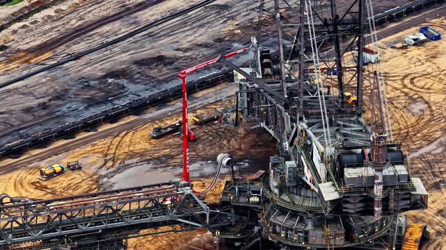 Aerial view of massive bucket-wheel excavator operating in open-pit lignite mine