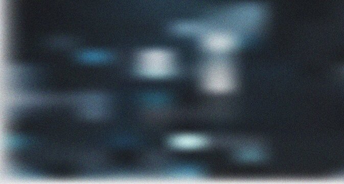 Deep charcoal and blue abstract with faint blurred highlights and pronounced grainy texture for modern graphics