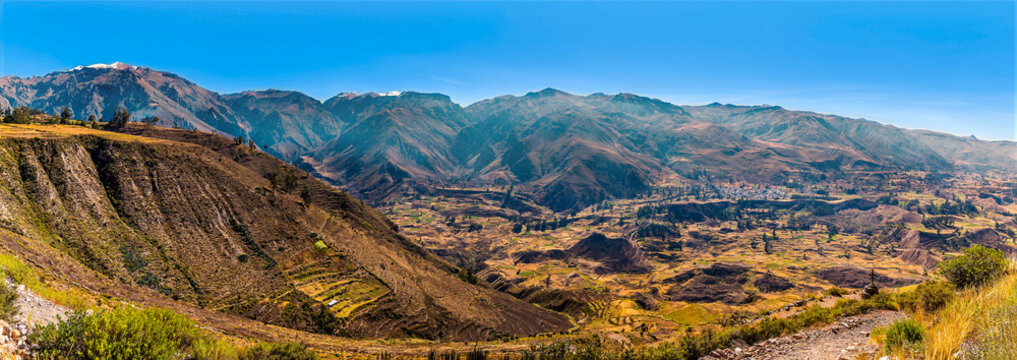 A panorama view into the Colca Canyon in southern Peru in the early morning