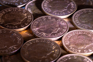 British pennies and two pence featuring Queen Elizabeth II profile portrait. British copper coins. Great Britain national currency. © Sergii