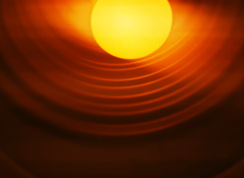 Abstract warm light coming from the electrical bulb background