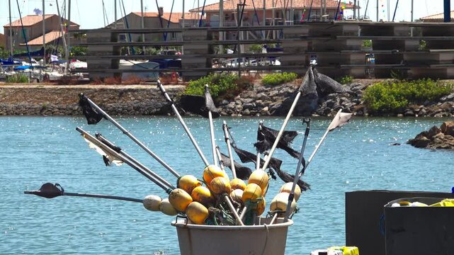 Fishing gear is near the marina water