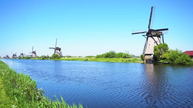 traditional dutch windmills row in Kinderdijk at summer day, Netherland