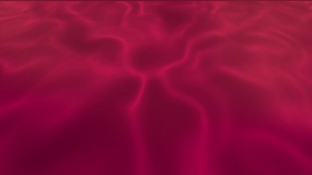 Red liquid silk wavy motion background smoothly flowing in a seamless wave pattern. Animated background. 4K animation.