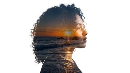 Double exposure portrait featuring a woman with curly hair superimposed over a scenic ocean sunset captured during golden hour © Maria