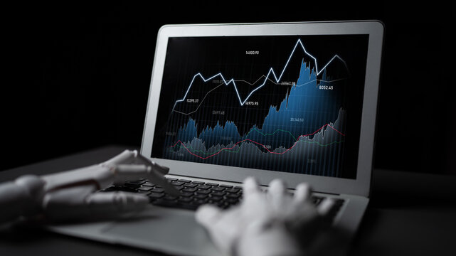 A laptop displays dynamic stock market data visualization as a robotic hand gestures towards the analytics, symbolizing the fusion of technology and finance. Scalp