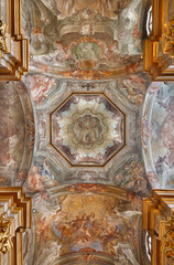 Naklejka premium VERCELLI, ITALY - JANUARY 16, 2026: The baroque fresco in the cupola and ceiling Glory of St. Cristophorus in the church Chiesa di San Cristoforo by Francesco Maria Bianchi from 18. cent.
