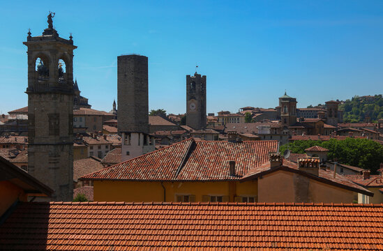 Panoramic view of medieval towers and tiled roofs in Bergamo upper city Lombardy Italy