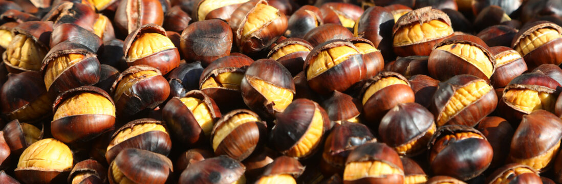 Delicious hot roasted chestnuts with cracked shells ready to eat