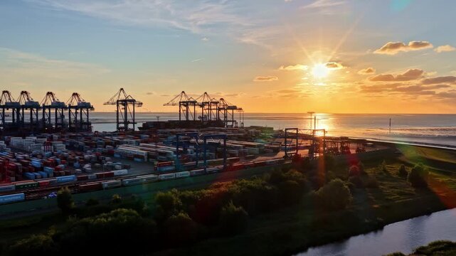 Aerial view of EUROGATE Container Terminal Bremerhaven at sunset with rows of shipping containers and cranes in Bremen, Bremen, Germany.