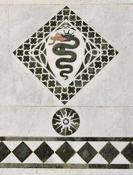 LUCCA, ITALY - JUNE 23, 2026: The detail of medieval marble intarsia  (snake) of church Cattedrale di San Martino by unknown artist (1210 &ndash; 1230).