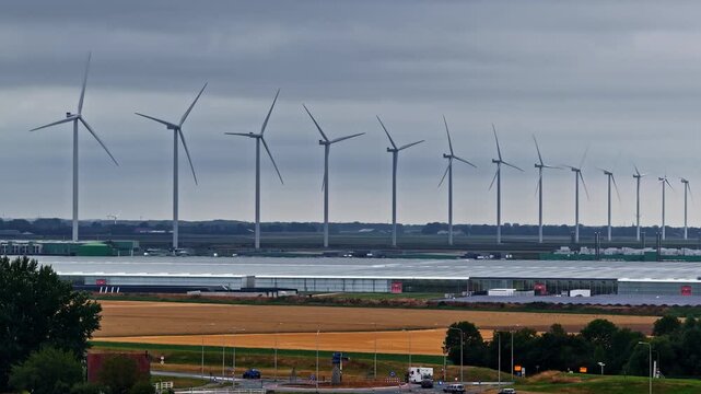 Aerial view of wind turbines and large greenhouse complex at Agriport A7 in Middenmeer, Noord-Holland, Netherlands.