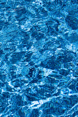Clear Blue Water Surface Showing Sunlit Ripples Creating Bright Dynamic Patterns © Wendy