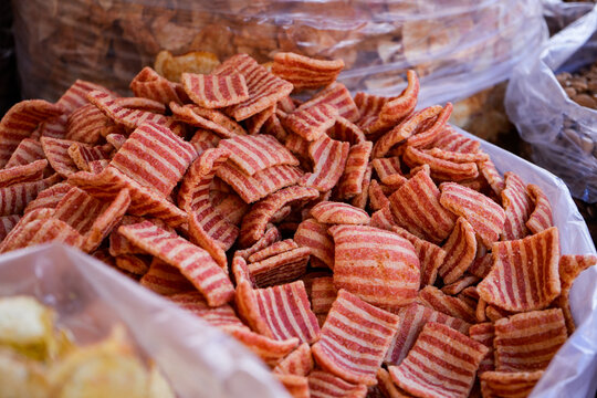 Pork rind chicharron in bulk inside a plastic bag at a market stall