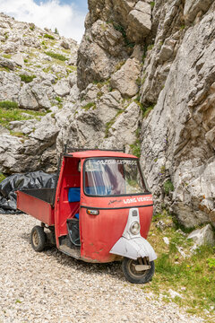 16 July 2026, Arabba, Italy. Red Coldai Express utility vehicle on a rocky alpine trail in the Dolomites