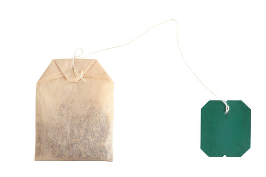 teabag with blank green label and string, herbal infusion bag, isolated on transparent background