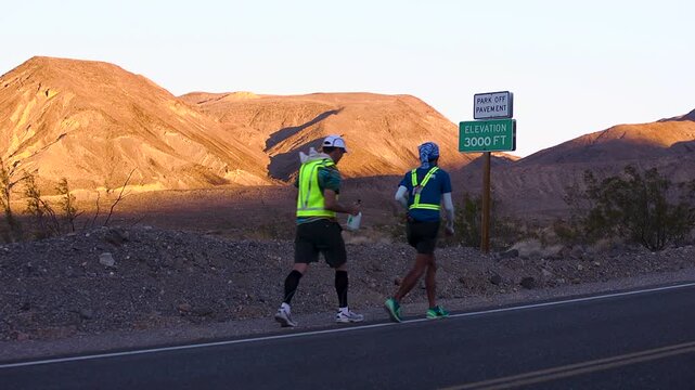 Athlete getting water spray down as they cross the 3000 feet mark in death valley