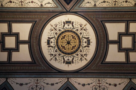 Ornate circular ceiling medallion with gold detailing