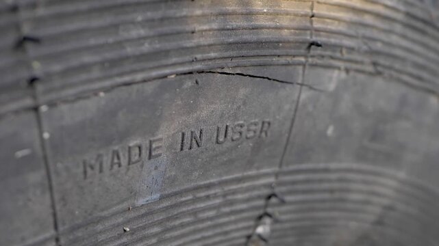 State quality mark of the USSR on the wheel of a truck. Made in USSR sticker. Soviet Union mark for the quality established