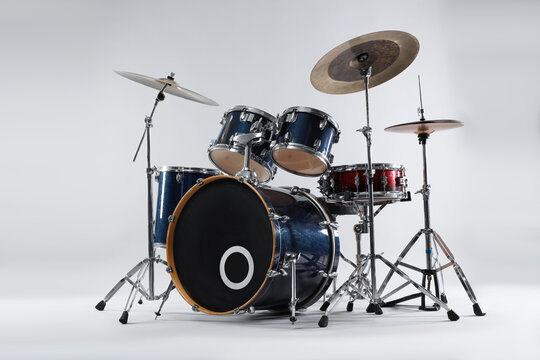 Modern drum set on white background. Musical instrument