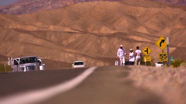 Low angle of badwater athletes running in death valley