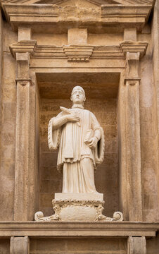 Statue of Saint Faustus on the facade of the Baroque Cathedral of Saint Agatha, historic center of Gallipoli, Salento, Puglia, Italy.