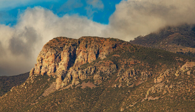 Clouds behind a series of Huachuca Mountain cliffs in early morning