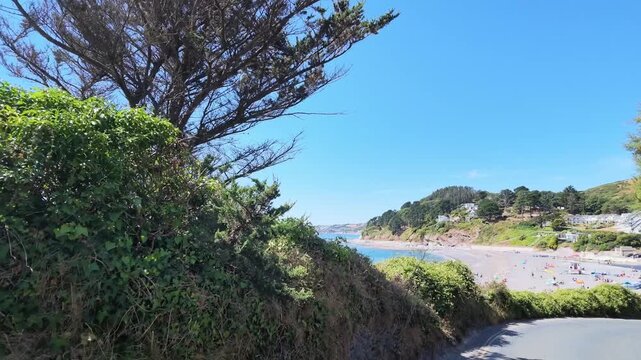 Cornwall England UK. 13.08.2026. Video.  A drive along the clifftop coastal road overlooking Whitsand Bay and drive down into Seaton  a Cornish seaside resort.