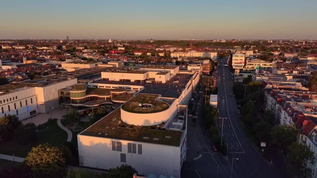Onlookers watch a 90 percent solar eclipse from the parking deck of a car dealership in Berlin. Stunning aerial view drone shot panorama from above